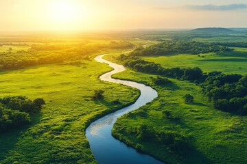 Obraz premium An aerial view of a winding river flowing through verdant fields beneath a bright, sunny sky, epitomizing the tranquility and beauty of nature's landscapes.