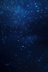 Fototapeta premium Sparkling snowflakes fall gently in a midnight blue winter sky, creating a tranquil atmosphere