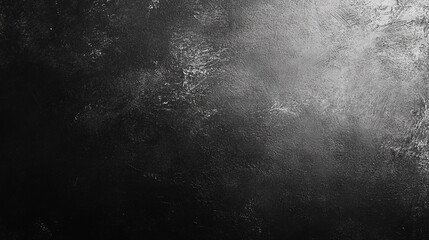 Dark textured surface with subtle lighting and gradients in varying shades of gray