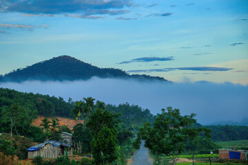 Beautiful scenery in Dong Giang, Quang Nam, Vietnam. White clouds stretch across the mountain ranges in the dawn light.