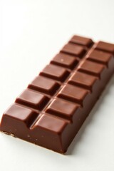 Rich milk chocolate bar on a white background, milk chocolate, snack