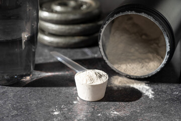 Amino acid food supplement, creatine powder in a measuring scoop, Sports nutrition 