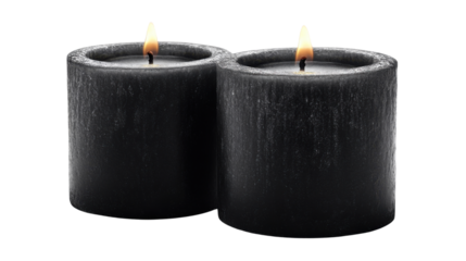 two elegant black  candle with soft glowing on white background