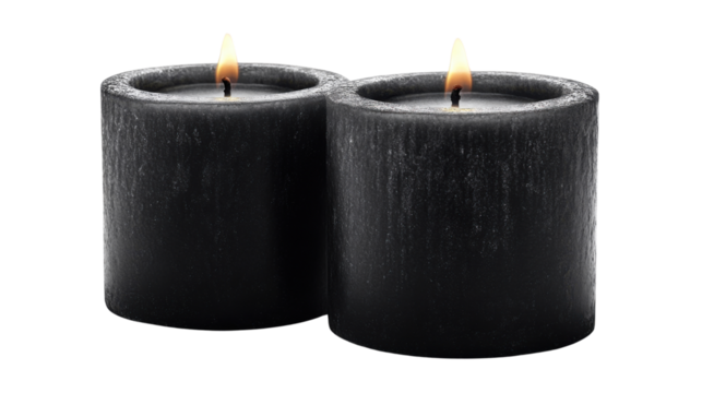 two elegant black  candle with soft glowing on white background