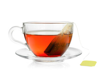 Cup with teabag isolated on white. Brewing aromatic tea