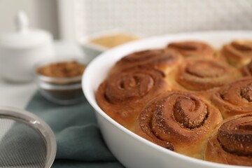 Freshly baked cinnamon rolls on table, closeup