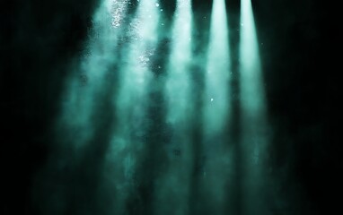 Teal spotlights in smoky darkness.