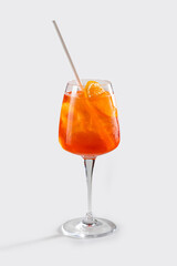 Fresh Aperol spritz cocktail with orange, straw and ice, stock, on white background