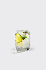Fresh caipirinha cocktail with lemon and ice, stock, on white background