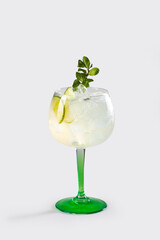 Fresh Gin Lemon cocktail with lemon garnish and ice, stock, on white backgrounde