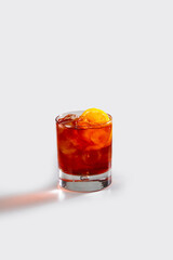 Fresh negroni cocktail with orange and ice, stock, on white background