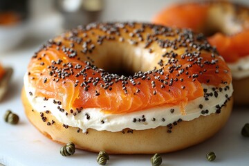 A close-up shot of a bagel topped with cream cheese and pepper sprinkles