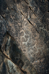 Petroglyphs in Tamgaly. Tamgaly is a petroglyph site in the Almaty region of Kazakhstan. Tamgaly became a UNESCO World Heritage Site in 2004. Tamgaly is located 170 km  northwest of Almaty.