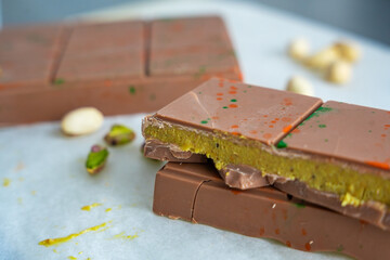 Trend Dubai chocolate with pistachio paste and kataifi dough. Confectionery handmade sweets at home in the kitchen. 