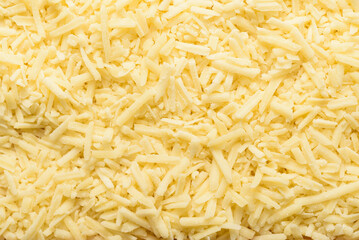 Grated parmesan cheese texture background. Ingredients for a traditional Italian meal.