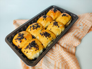 Banana cake or bolen sprinkled with chocolate sprinkles isolated on white background