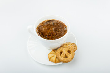 Danish cookies on a white background with coffee in a white cup, freshly brewed American coffee, isolate, breakfast, pastries, delicious shortbread cookies, catalog photo of food, coffee in bed