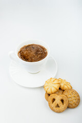 Danish cookies on a white background with coffee in a white cup, freshly brewed American coffee, isolate, breakfast, pastries, delicious shortbread cookies, catalog photo of food, coffee in bed