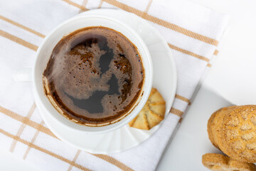 Danish cookies on a white background with coffee in a white cup, freshly brewed American coffee, isolate, breakfast, pastries, delicious shortbread cookies, catalog photo of food, coffee in bed