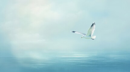 Obraz premium Seagull gliding gracefully above serene ocean in tranquil sky setting