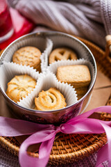 shortbread Danish cookies, red candle, red and pink silk ribbons, Valentine's Day, romantic atmosphere, Valentine's Day gift, delicious dessert for the holiday, tea cookies
