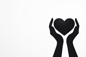 Fototapeta premium A pair of hands gently holding a heart symbol, representing love and care.
