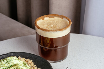 coffee in a cup and dessert on a plate