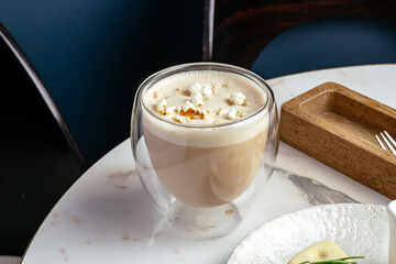 coffee in a cup and dessert on a plate