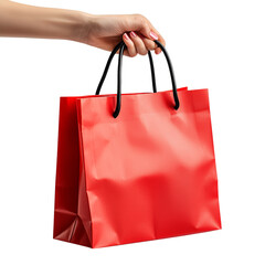 Hand Holding a Red Shopping Bag Against Red Background Isolated on transparent background