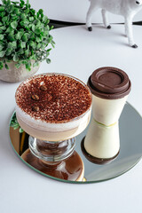 coffee in a cup and dessert on a plate