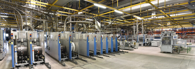 modern machines for transportation in a large print shop for production of newspapers & magazines