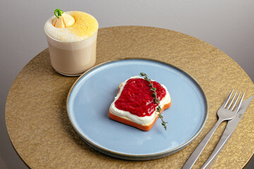 coffee in a cup and dessert on a plate