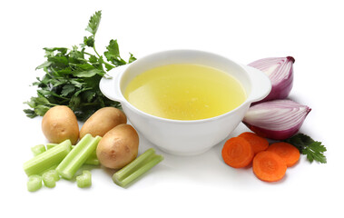 Tasty chicken bouillon in bowl and ingredients isolated on white
