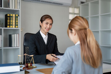 Lawyer discussing contract details with a client in a modern legal office