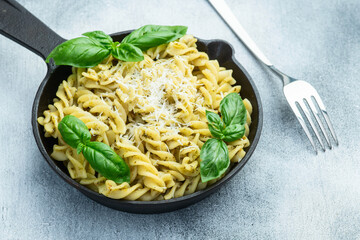 Pasta with basil sauce pesto . Italian food photography . Top view