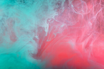 clouds of red and blue turquoise smoke on black background, clouds of paint in water, aquarium, abstract background, texture
