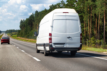 White cargo minibus transports household products, high delivery speed and low cost, industry. Copy space for text