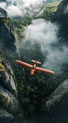 An orange airplane soaring over misty mountains and lush green valleys.