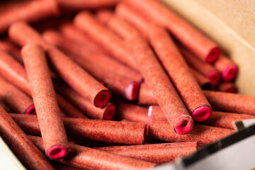 A bunch of firecrackers with red sulfur. Set of pyrotechnics, explosion hazard, macro.
