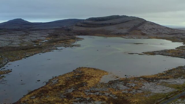 Aerial Dolly of Mullaghmore Mountain with Seasonal Lake in the Foreground. Ireland