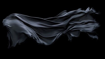 Elegant black fabric in motion floating on a dark background creating abstract forms