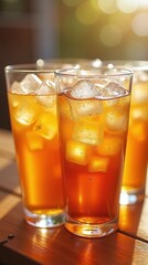 Fototapeta premium Cold drinks Iced tea Glass tumblers Amber liquid