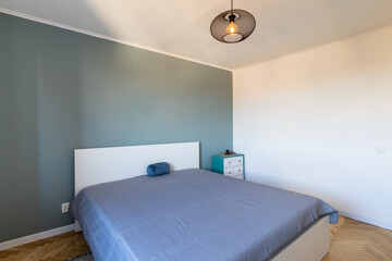 Modern Minimalist Bedroom Interior with Gray and White Decor and Wooden Flooring. Home Interior