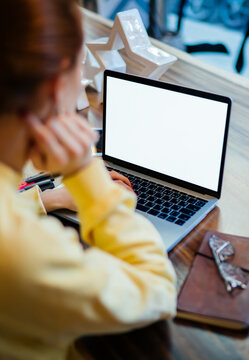 Selective focus on modern blank laptop computer with copy space area for advertising web text used for online networking and chatting by millennial woman, mock up screen on digital netbook