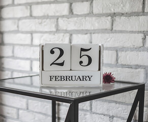 25 February from wooden blocks with letters, important date concept