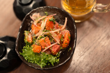 Thai menu food as Larb salmon on table. Spicy salmon salad, delicious and tasty, good looking, has chopped onion on top made feels spicy
