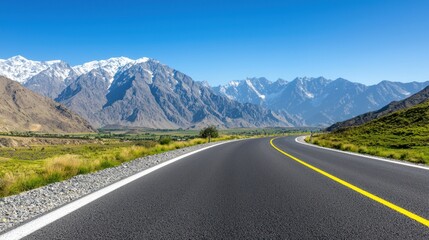 Naklejka premium Asphalt road through majestic mountains