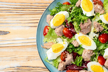 Canned Tuna salad with eggs and tomatoes photography . Top view