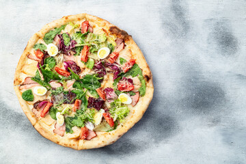 Italian pizza caesar with eggs salad chicken tomatoes and mozzarella photography. top view