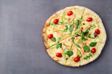 Italian pizza with avocado salmon  tomatoes and mozzarella photography. top view